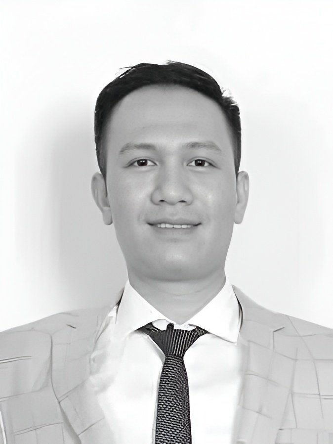 Smiling man in suit and tie headshot