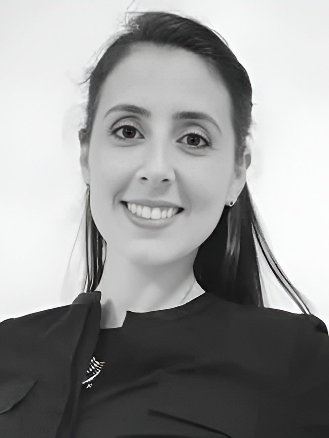 Smiling woman with dark hair, black top
