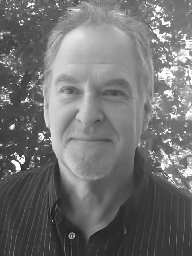 Smiling man portrait with leafy background