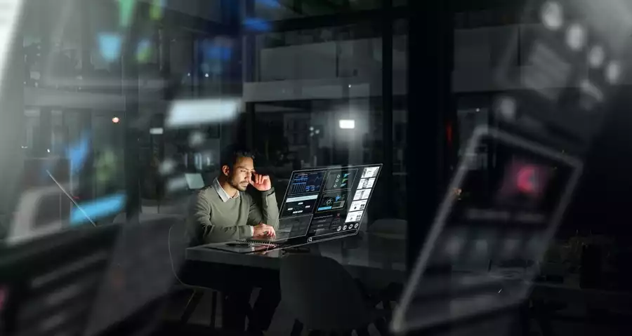 Futuristic and digital looking man in a dark room